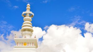 A Spire with a blue sky and clouds