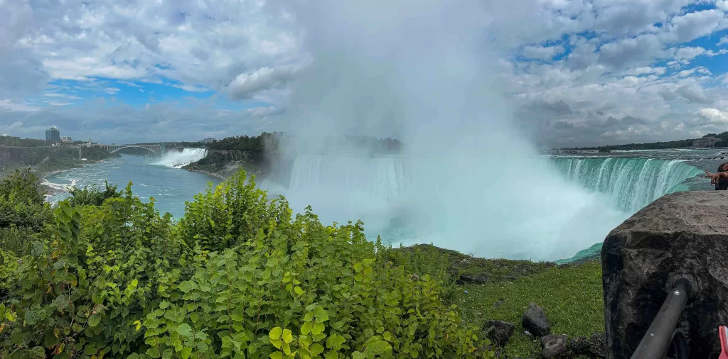 A waterfall with a large body of water