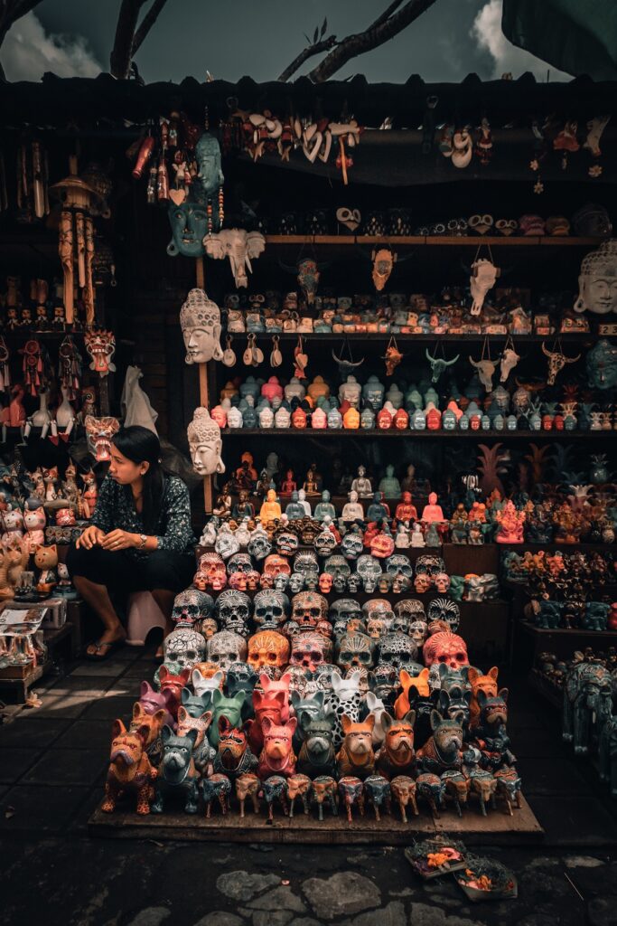 a person sitting in a store with colorful objects