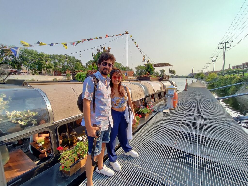 A person and person standing on a dock