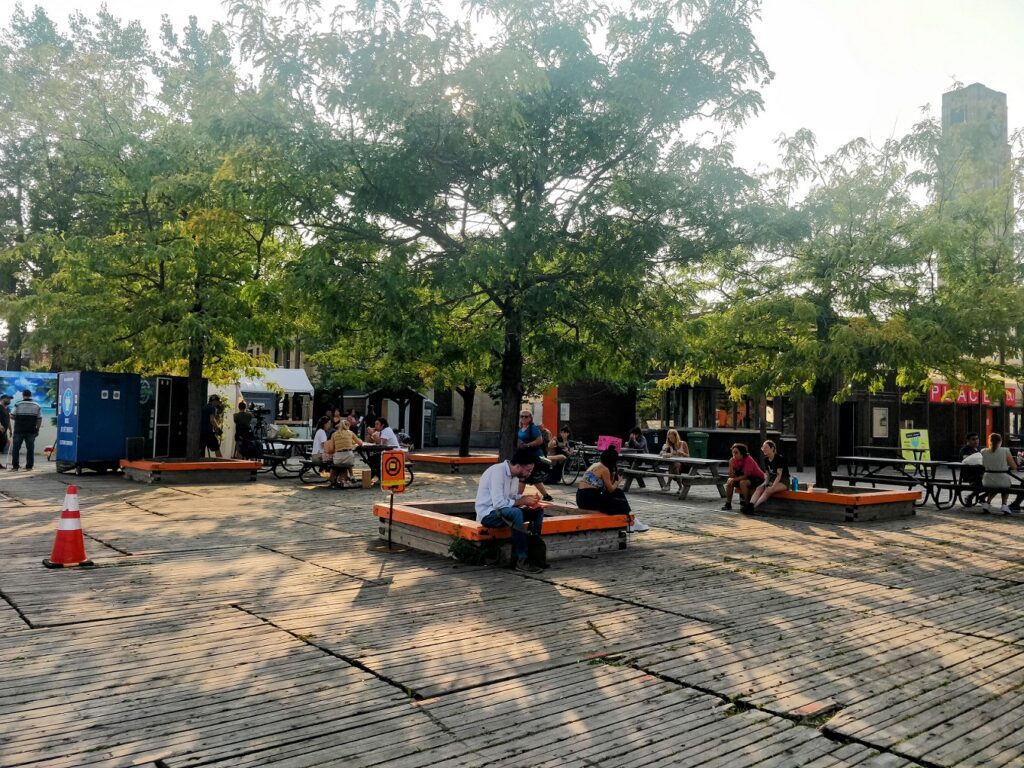 People sitting on benches in a park