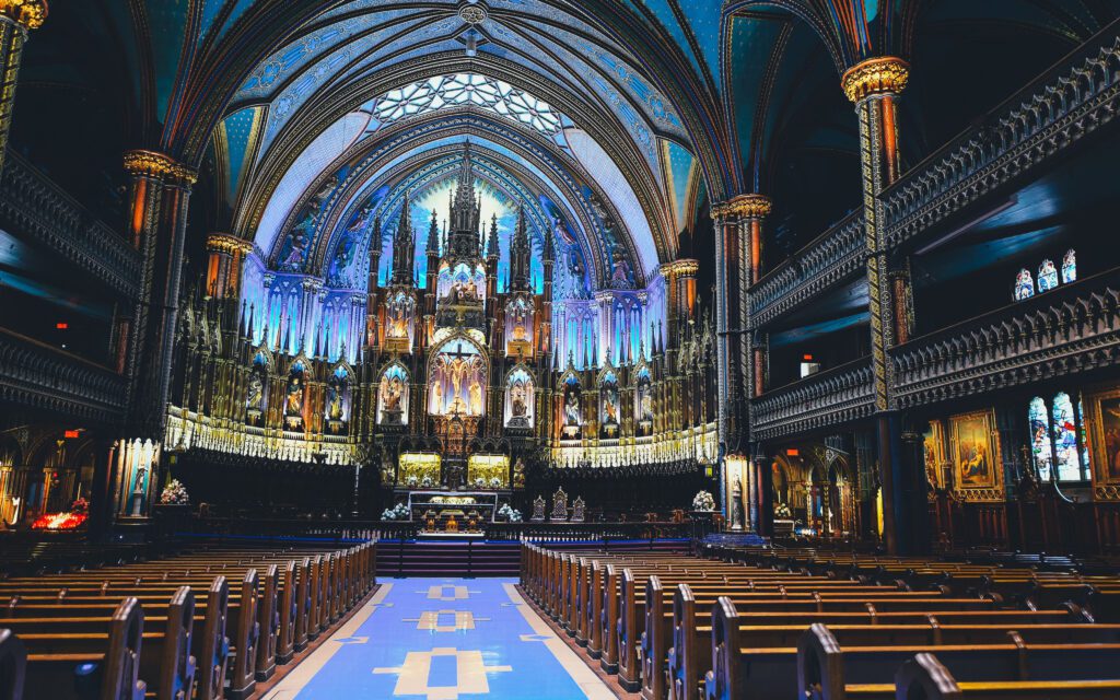 A famous symbol of Architecture of Montreal Notre-Dame Basilica with blue ceiling.