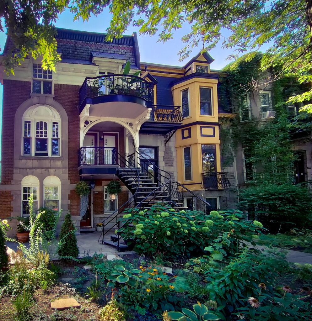 A building with a staircase and trees