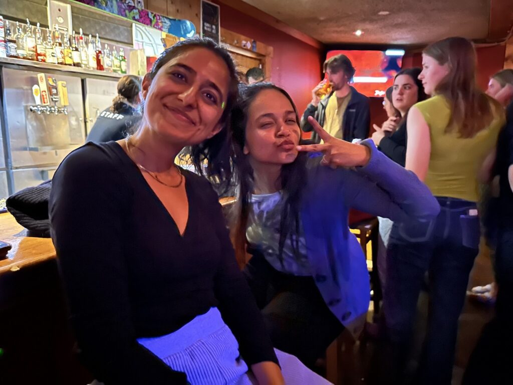 A group of women posing for a picture in a bar