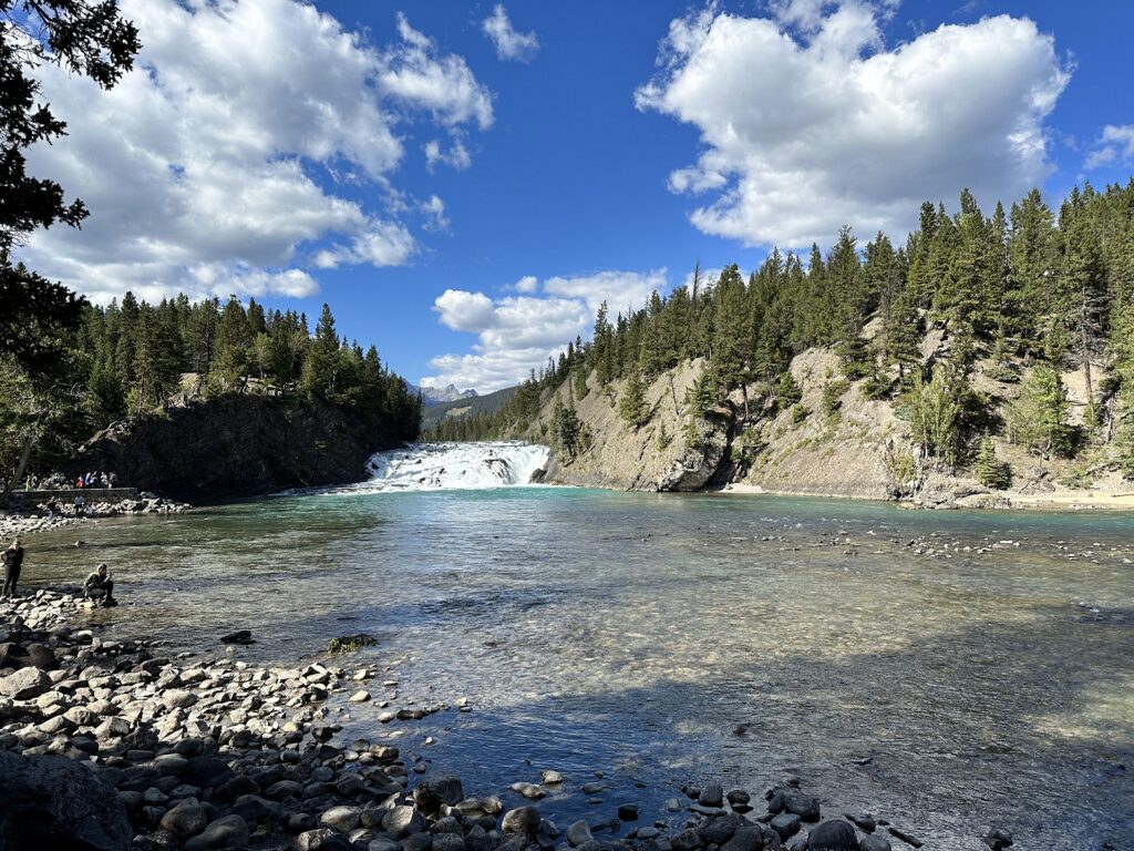 A river with trees and Bow Falls