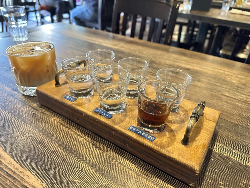 A tray of shot glasses on a table