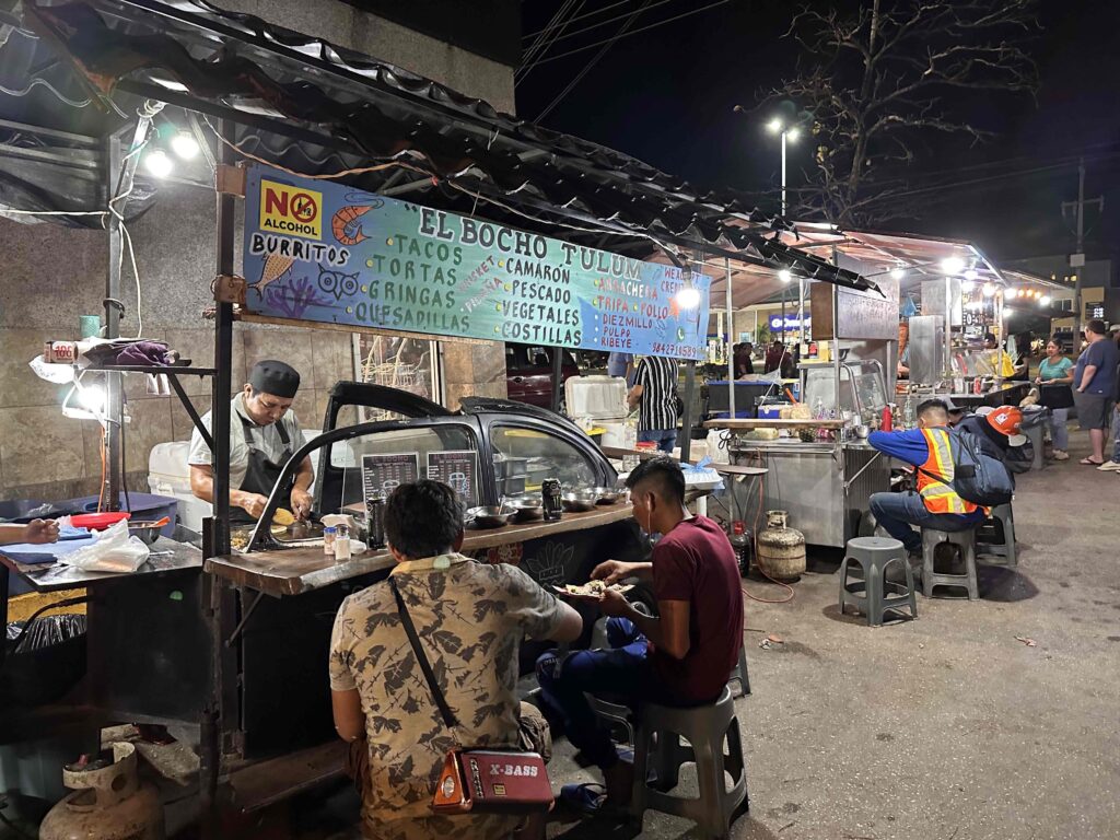 People at a food stand. Experience this in the local 3-day Tulum Itinerary