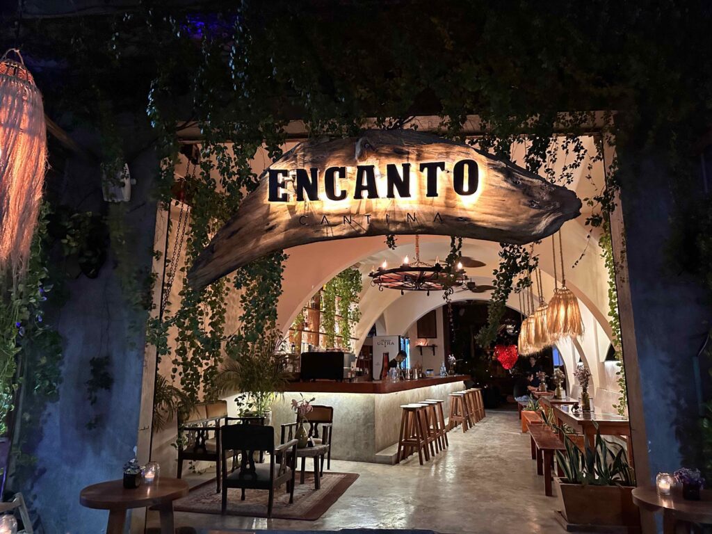 A restaurant named Encanto at night