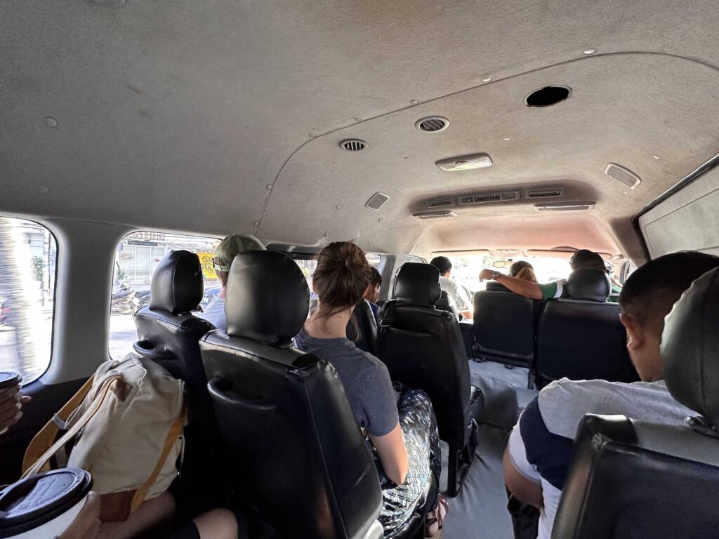 A group of people in a van going to visit Cenotes in Chemuyil