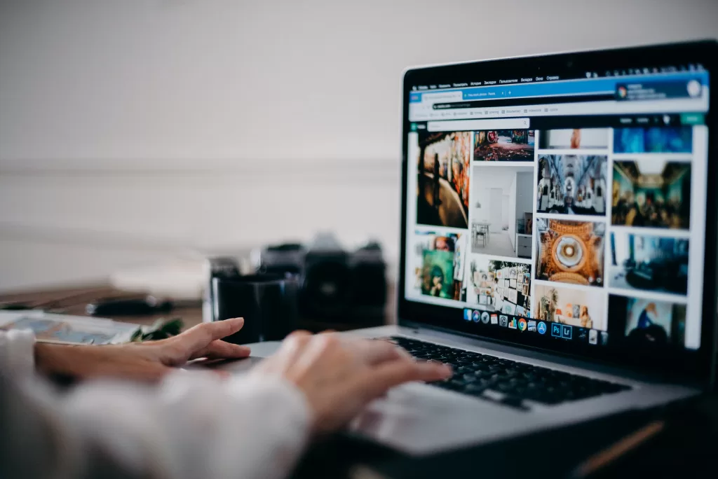 A person typing on a laptop. Plan like a local backpacker and see what lies ahead.