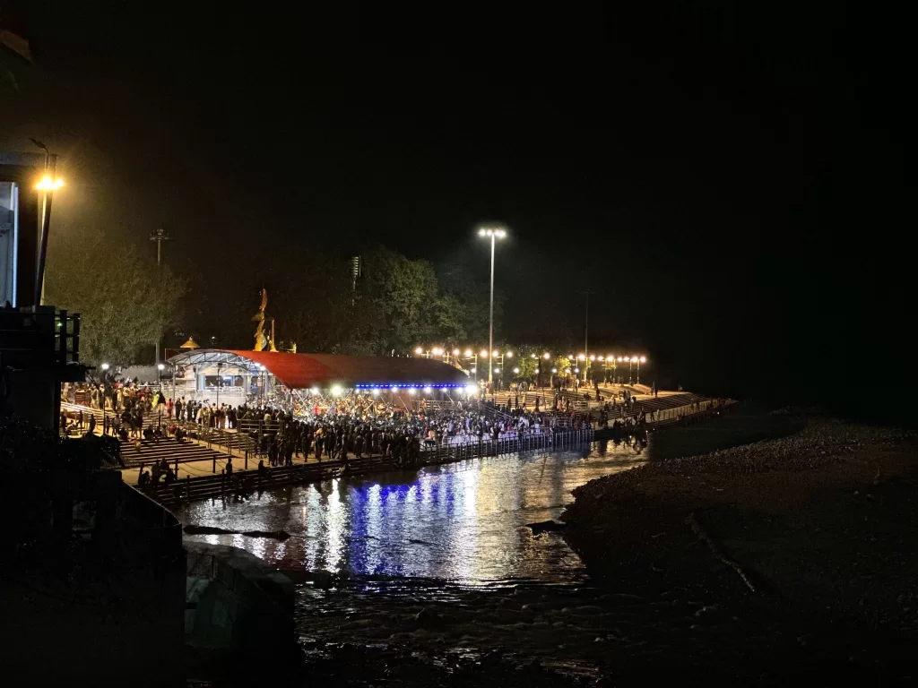 A river with a crowd of people at night