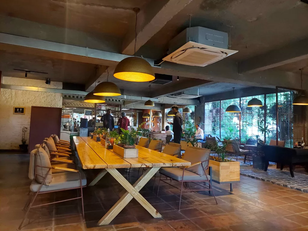 A large table with chairs and a large ceiling