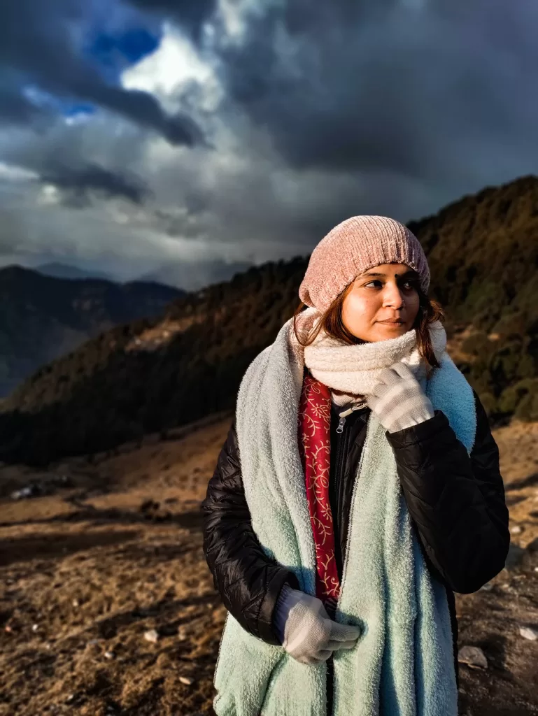 A person in a hat and scarf