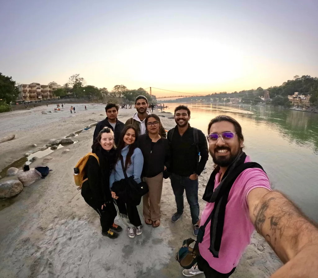 A group of people standing on a beach