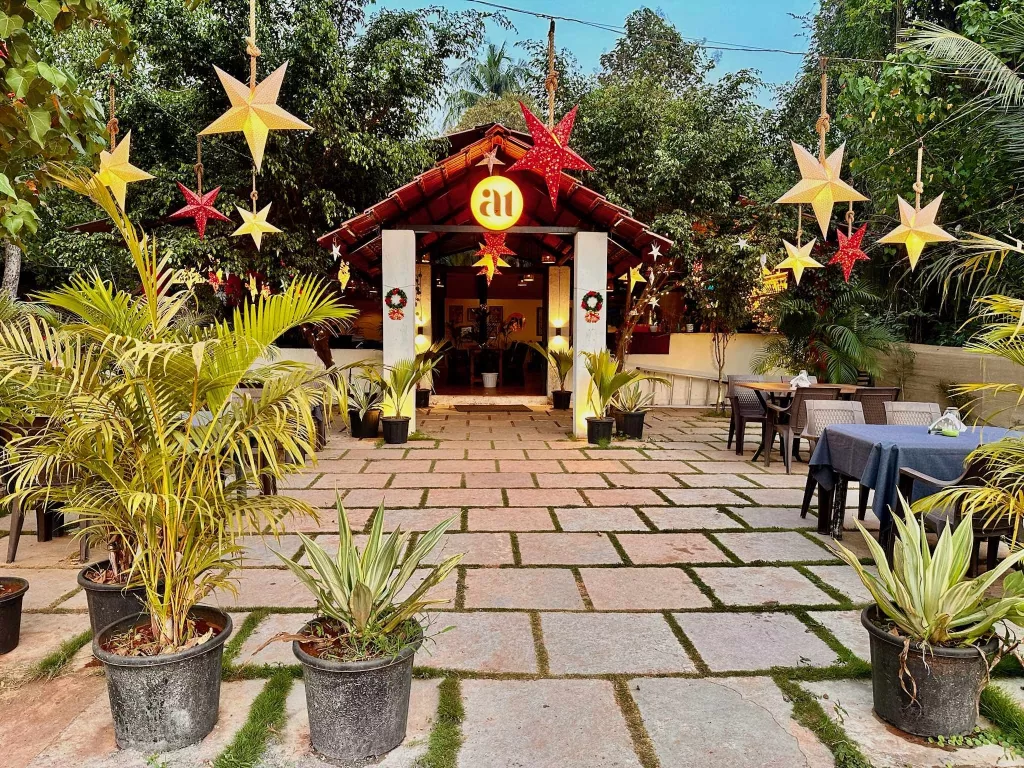 A building with a roof and plants