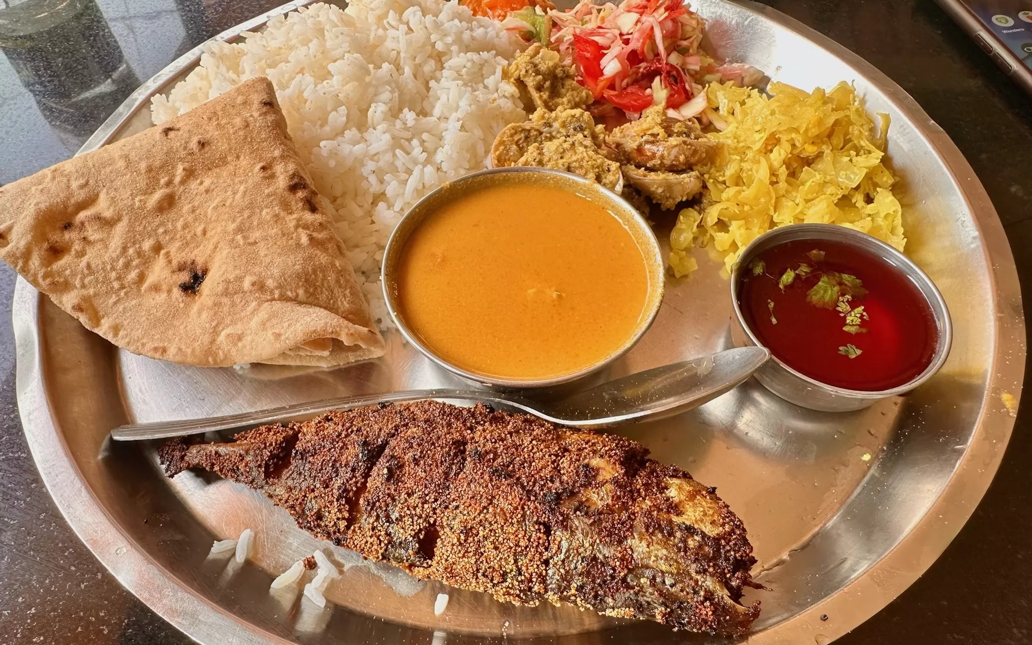 A plate of food with sauces and bowls