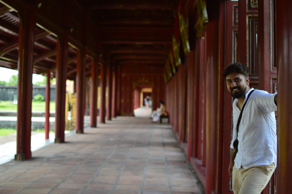 A person standing in a red corridor