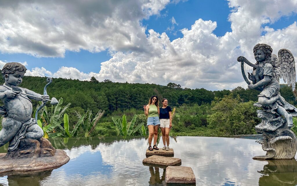 Two people standing on a pool