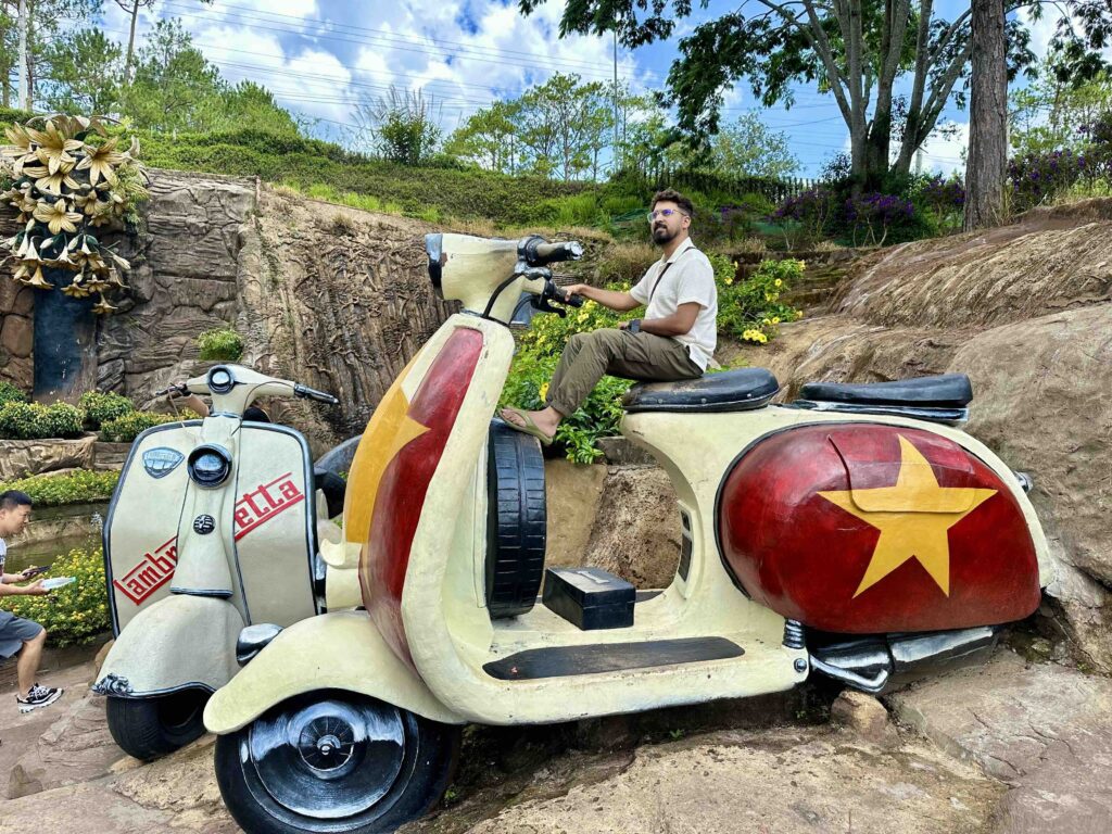 A man sitting on a large scooter