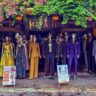 A street shop in Hoi An with manequins showcasing different suits. Tailoring in Hoi An