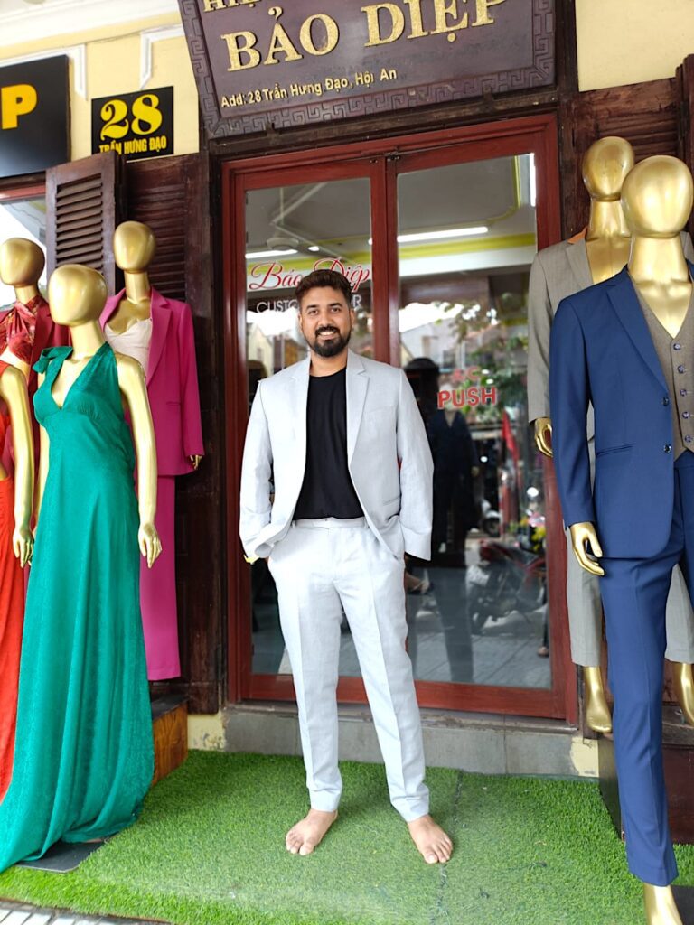 Dressed in customised suit from Hoi An.