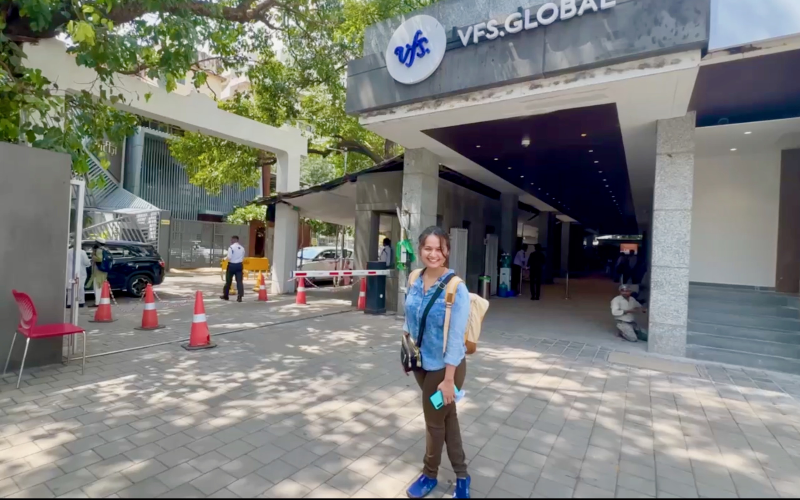 A person standing in front of VFS global office in Mumbai.