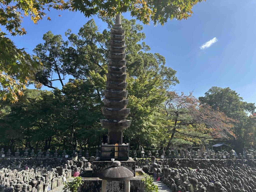 A 13 tired pagoda in the center of lots of grave stones at Adashino Nenbutsuji temple, Japan