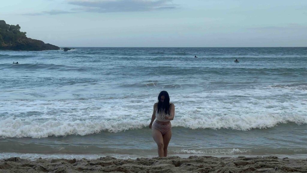 A person coming out of the water at Hiriketya beach, South Sri Lanka